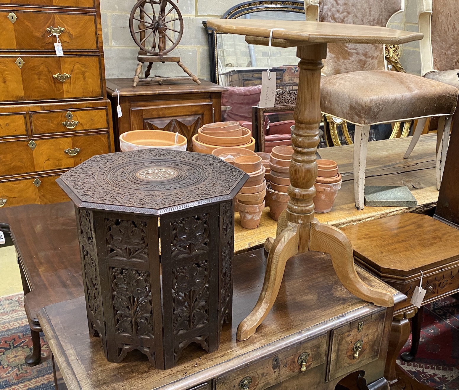 A Victorian style octagonal pine tripod wine table, width 47cm, height 72cm together with an Indian bone inlaid octagonal hardwood folding occasional table